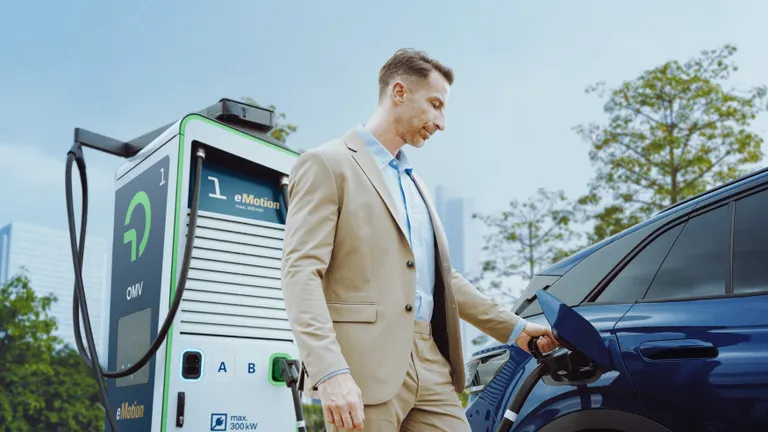 A man charging his car.