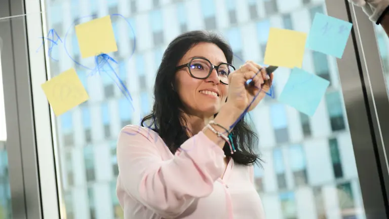 A woman planning something on a board